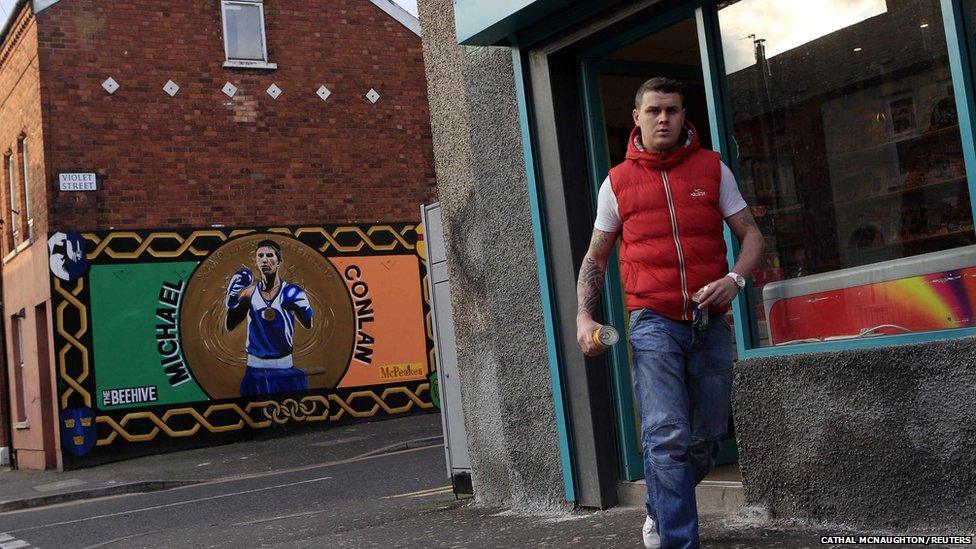 A mural features Irish boxer Michael Conlan winning a bronze medal in the flyweight division at the 2012 Olympics on a wall in the Falls Road area of west Belfast