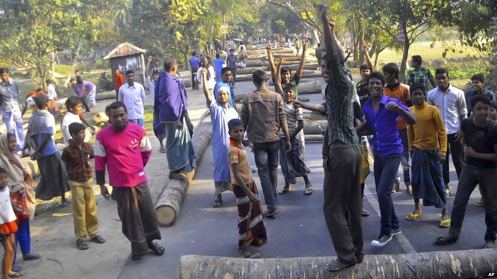 Protesters use logs to block traffic during a nationwide strike called by Jamaat-e-Islami in Rajshahi, Bangladesh