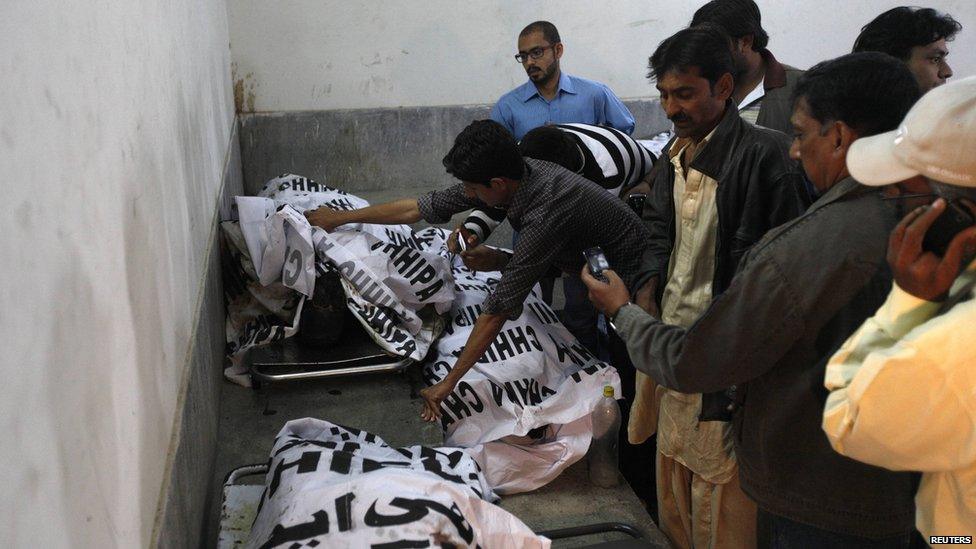 elatives search for bodies of their loved ones in a morgue in Karachi. Photo: 3 March 2013