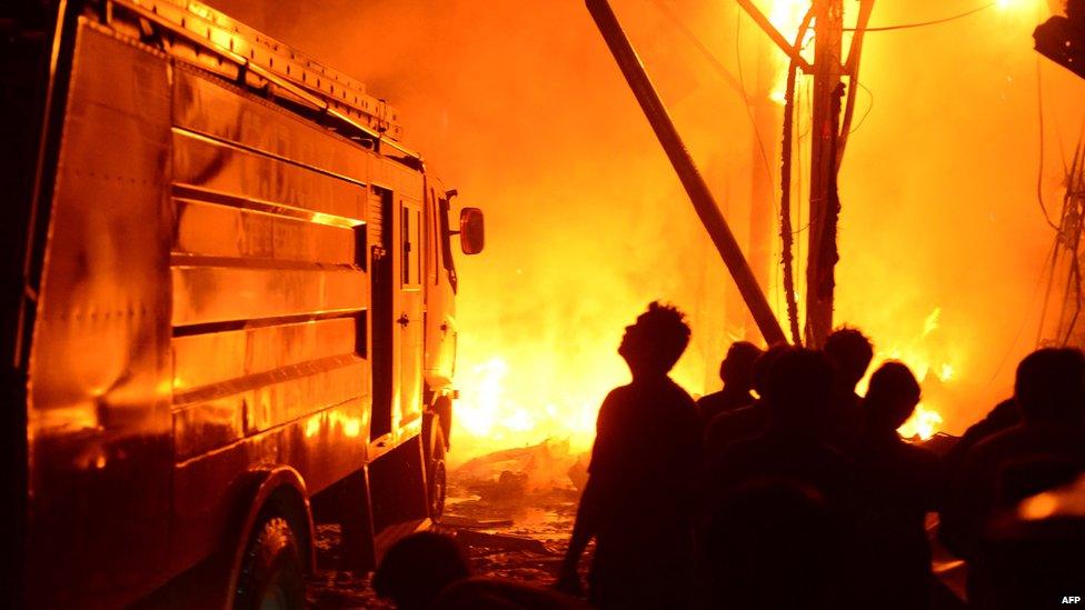 Rescuers work at the site of the bomb blast. Photo: 3 March 2013