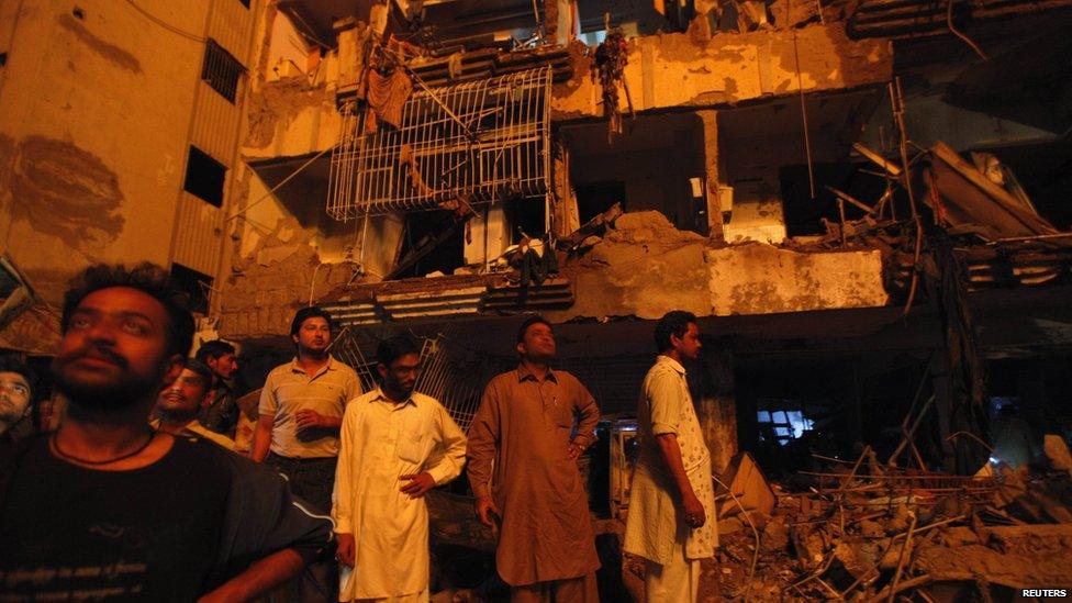 Local residents assess the damage. Photo: 3 March 2013