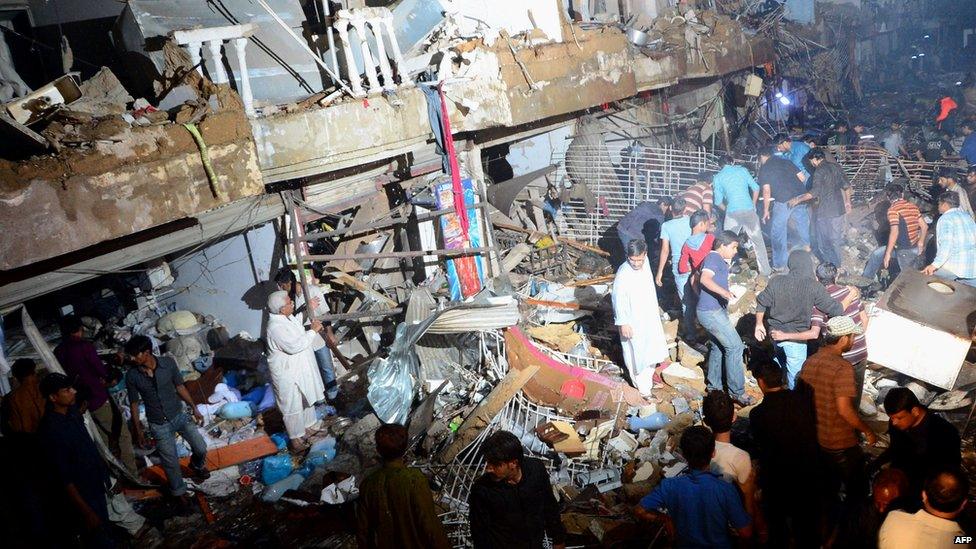 People gather on the site of the bomb blast. Photo: 3 March 2013