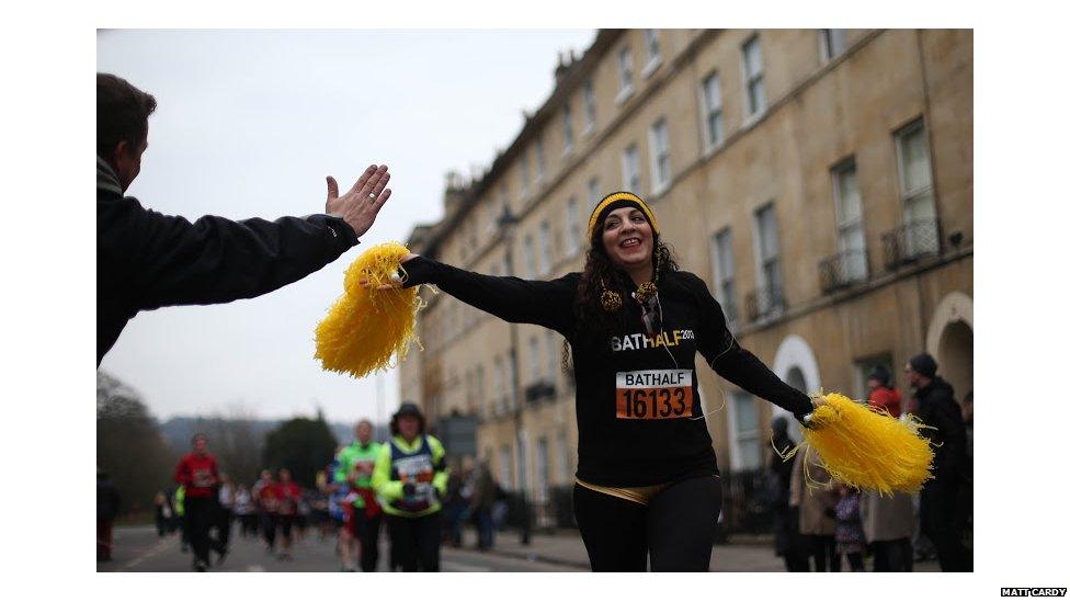 Getting a high five from one of the many enthusiastic supporters in the crowd