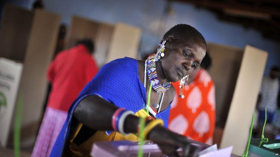 A Masaai woman casts her vote in the general election in Ilbissil, Kenya. 4 March 2013