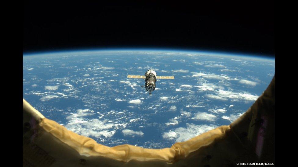 An unpiloted ISS Progress resupply vehicle approaches the International Space Station