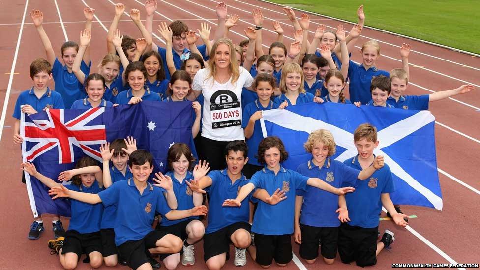 Hurdler Sally Pearson celebrates with school children in Sydney, Australia