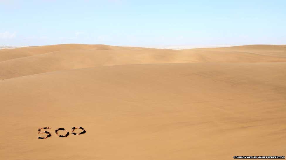 Group of young gymnasts in the dunes of the Namib Desert in Namibia