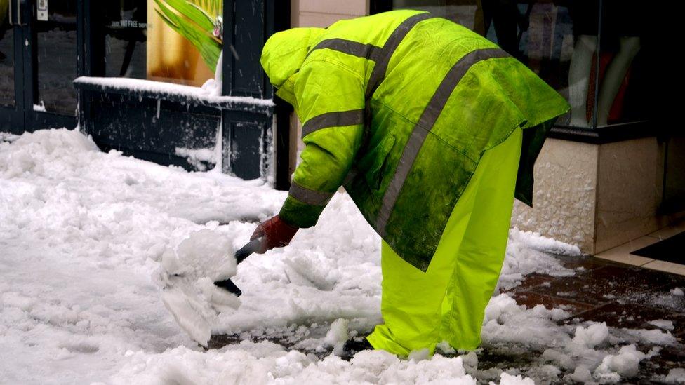 Parish of St Helier worker clearing snow