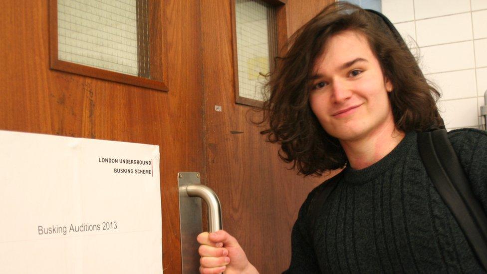 Ben Hudson enters a restricted area at Charing Cross station to play his guitar and ukulele