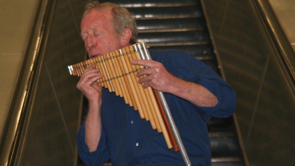 John Smith plays the panpipes