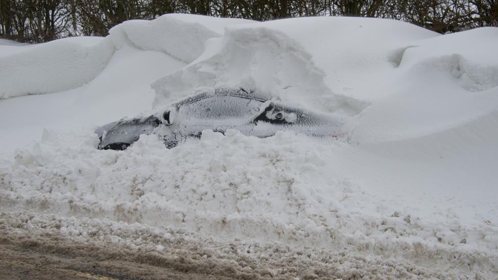 Snow-covered car. Photo: Chris Newman