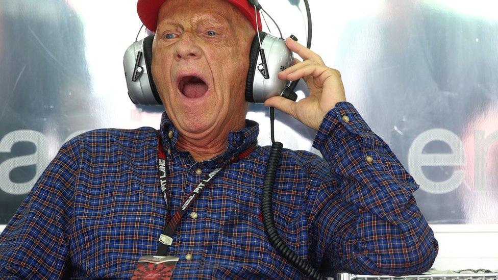 Niki Lauda yawns as he watches qualifying