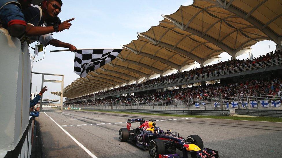 Sebastian Vettel passes the finish line