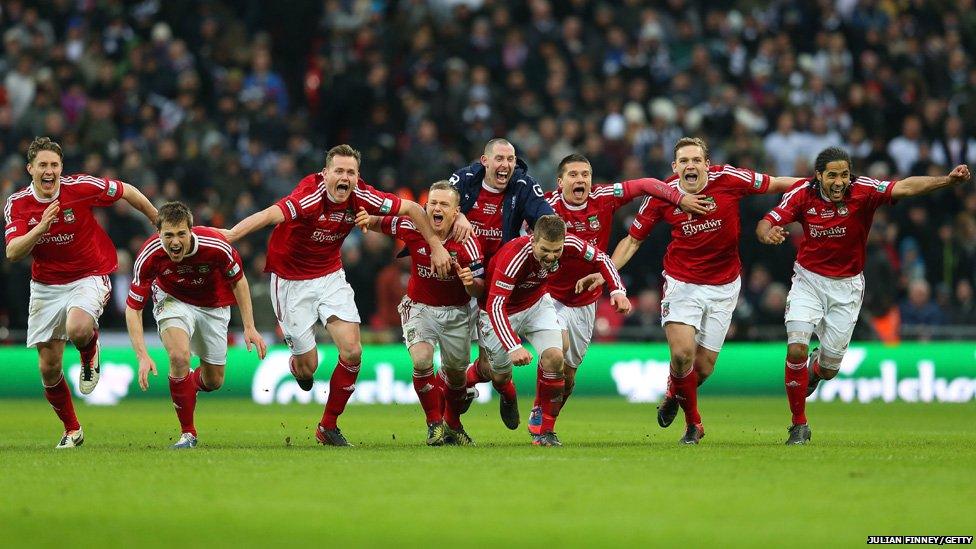 Wrexham players celebrate winning the FA Trophy