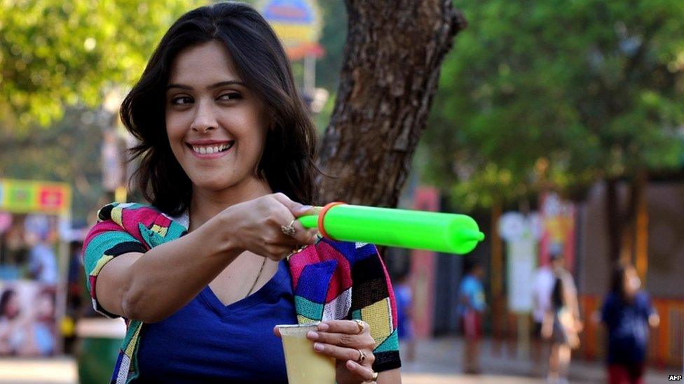 Indian Bollywood actress Hrishita Bhatt strikes a pose during a promotional event ahead of the spring festival of Holi in Mumbai on March 21, 2013.