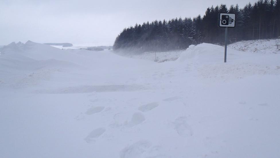 Snow on the road outside Llyn Brenig Visitor Centre, Conwy