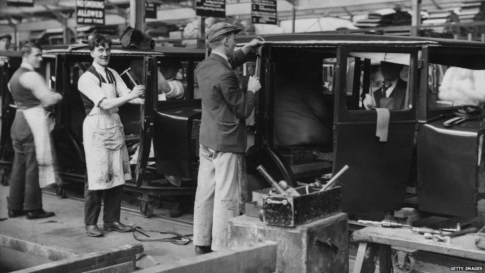 Workers upholstering and trimming new car bodies at Morris Motors, Cowley, Oxford. (Photo: Douglas Miller/Getty Images)