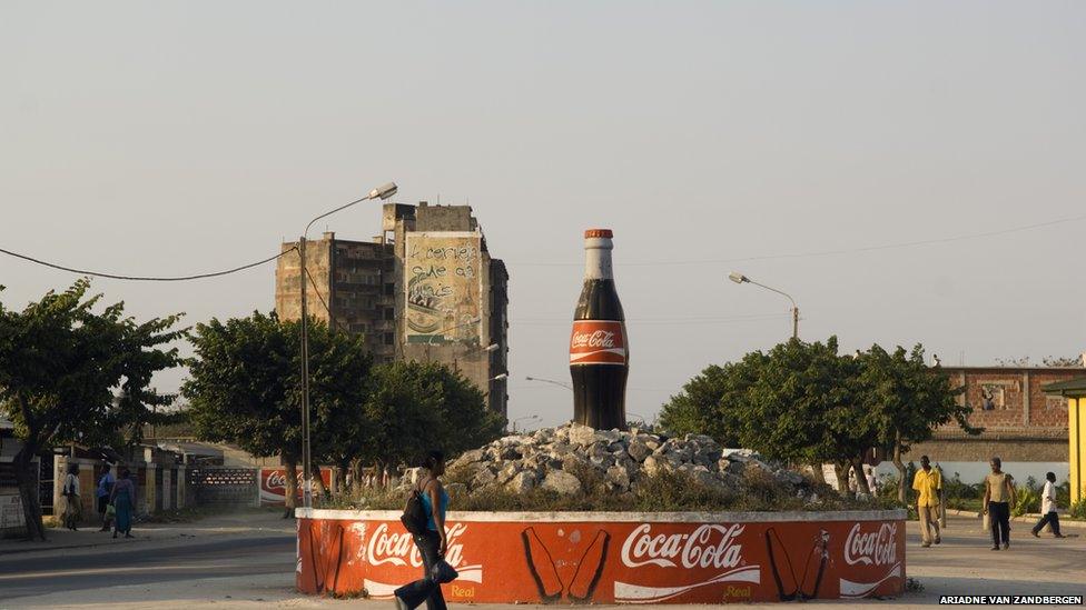 A Coca-Cola bottle dominates a roundabout in Maputo city, Mozambique