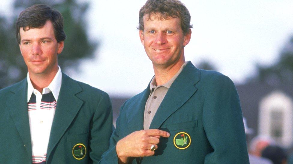 Sandy Lyle celebrates his 1988 Masters win, watched by former champion Larry Mize (left)