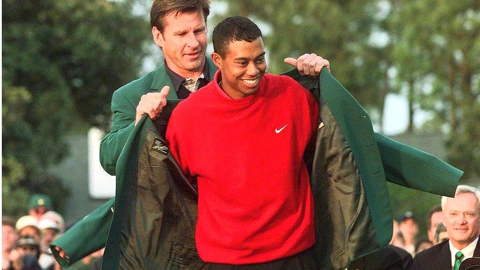 Nick Faldo presents Tiger Woods with his first Green Jacket