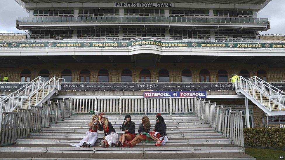 Women on steps at Aintree