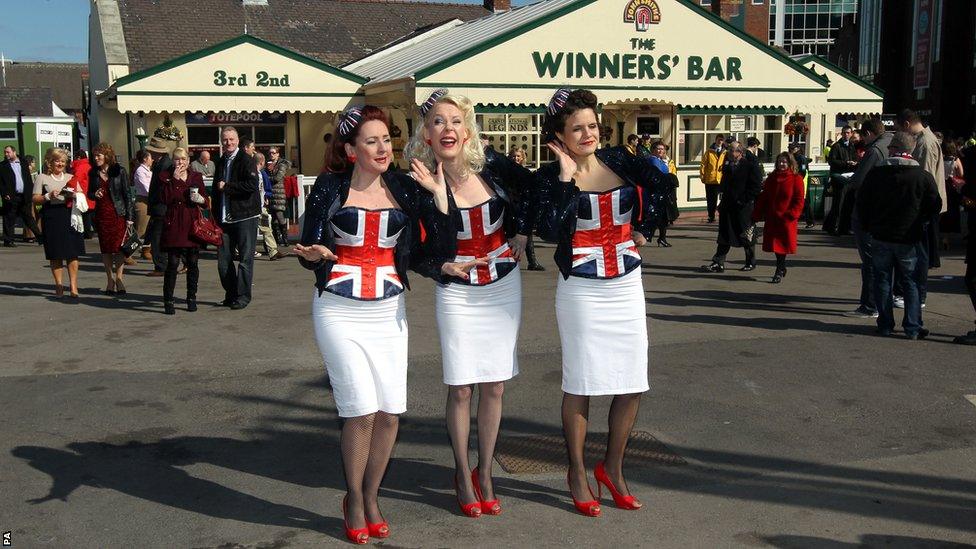 Singers entertain the crowd at Aintree