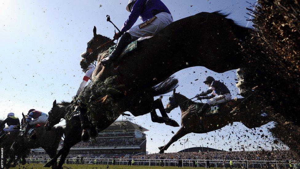 Competitors jump over The Chair