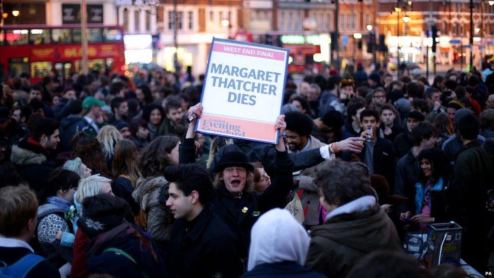 People gather to celebrate the death of Baroness Thatcher in Brixton, south London.