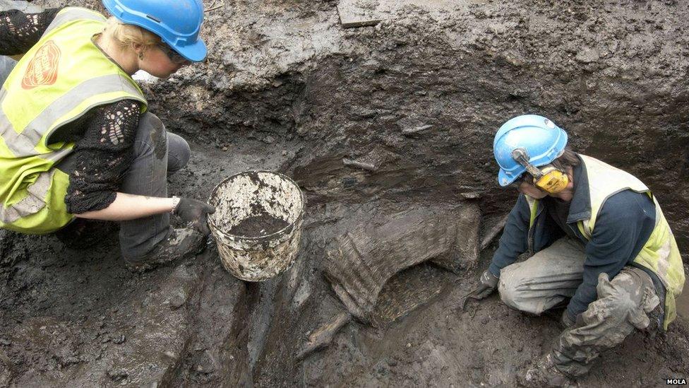 Archaeologists dig at the site in London