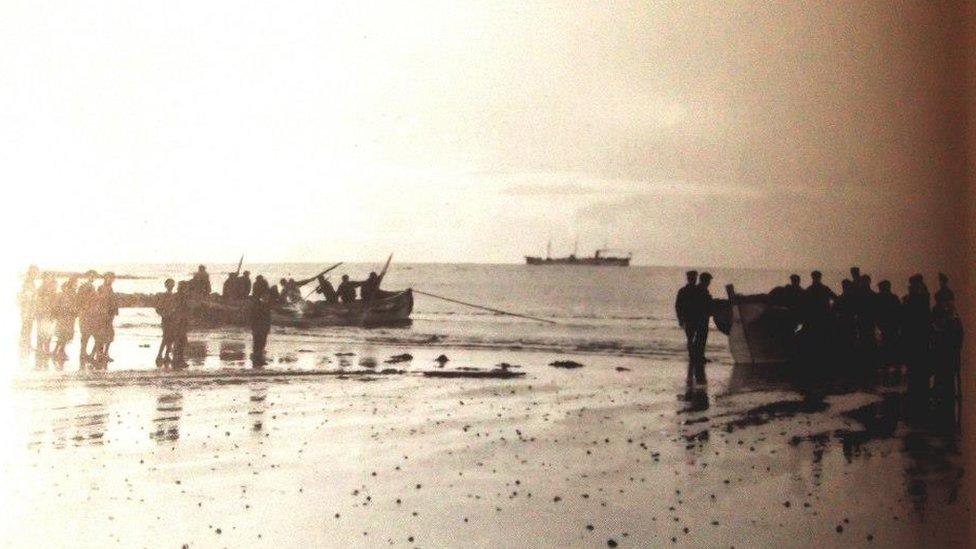 Boats landing on the beach