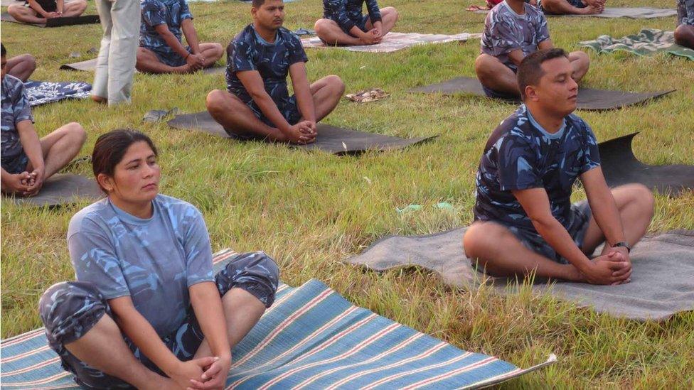 Police officers at yoga class