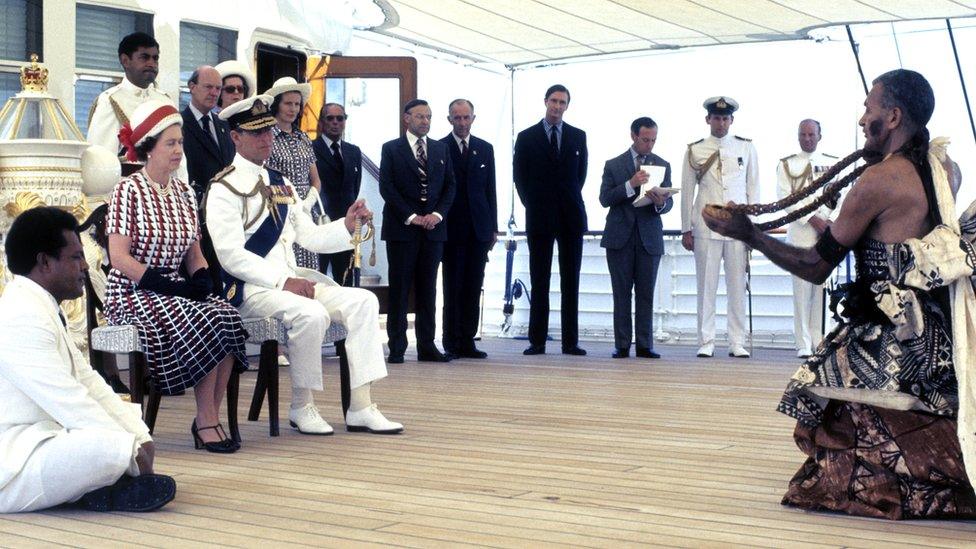 The Queen and the Duke of Edinburgh are entertained by Fijian musicians and traditional dancers in 1977