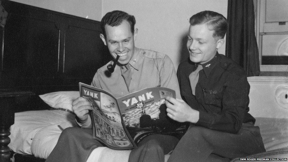 Lt George Thomas Hartman and Lt Robert Earl Belliveau reading a magazine