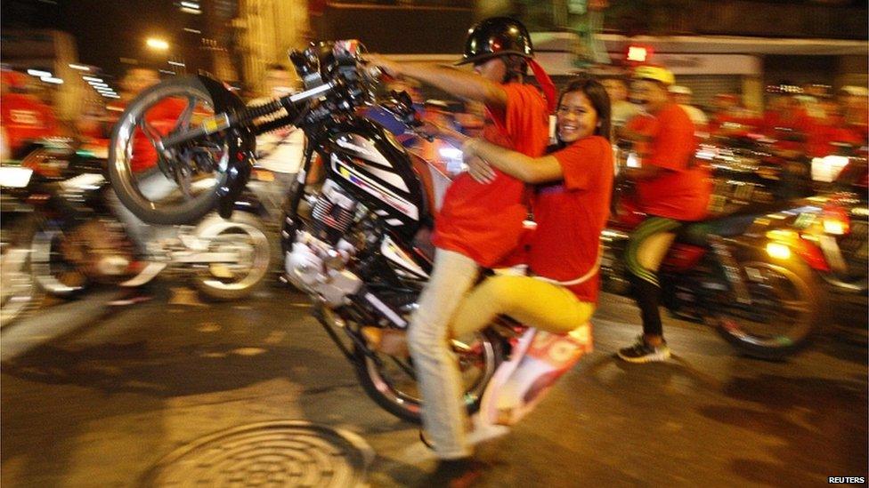 Supporters of Nicolas Maduro celebrate in the streets of Caracas after his victory in the presidential election