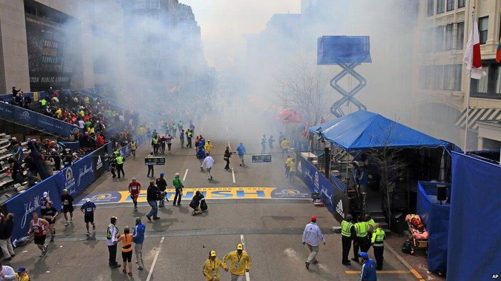 The finish line of the Boston Marathon shrouded in smoke, 15 April 2013