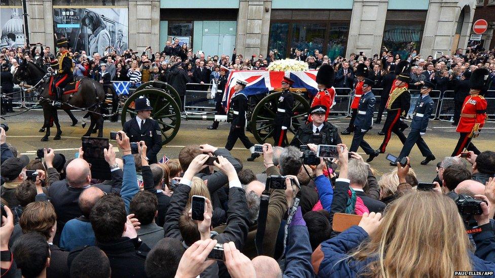 The coffin of British former prime minister Margaret Thatcher is carried on a gun carriage