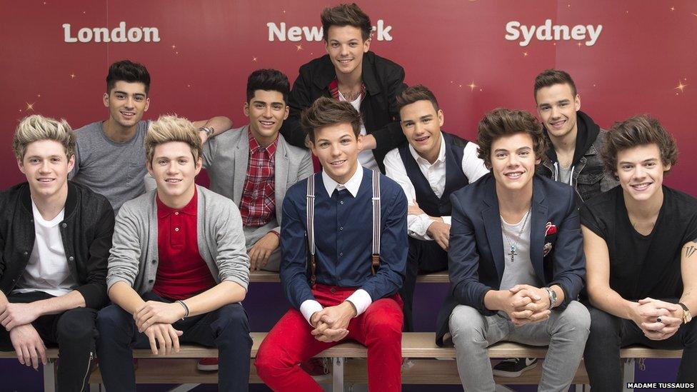 One Direction with their waxworks.