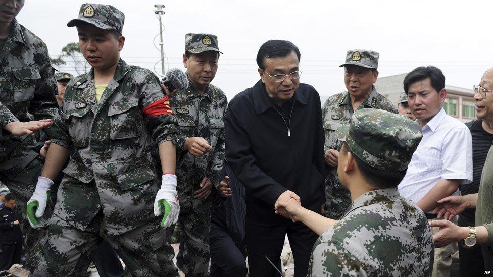 Li Keqiang (C) visits after a strong earthquake hits Lushan county, Sichuan province, April 20