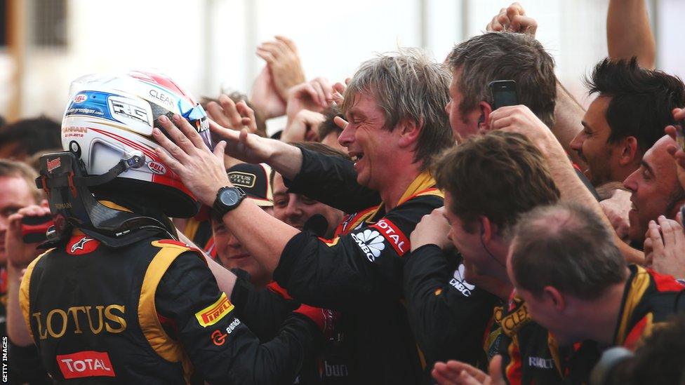 Romain Grosjean and Lotus pit crew celebrate