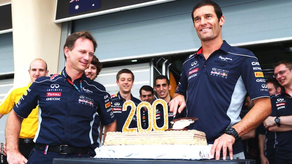 Mark Webber receives a cake from Red Bull colleagues to celebrate his 200th Grand Prix