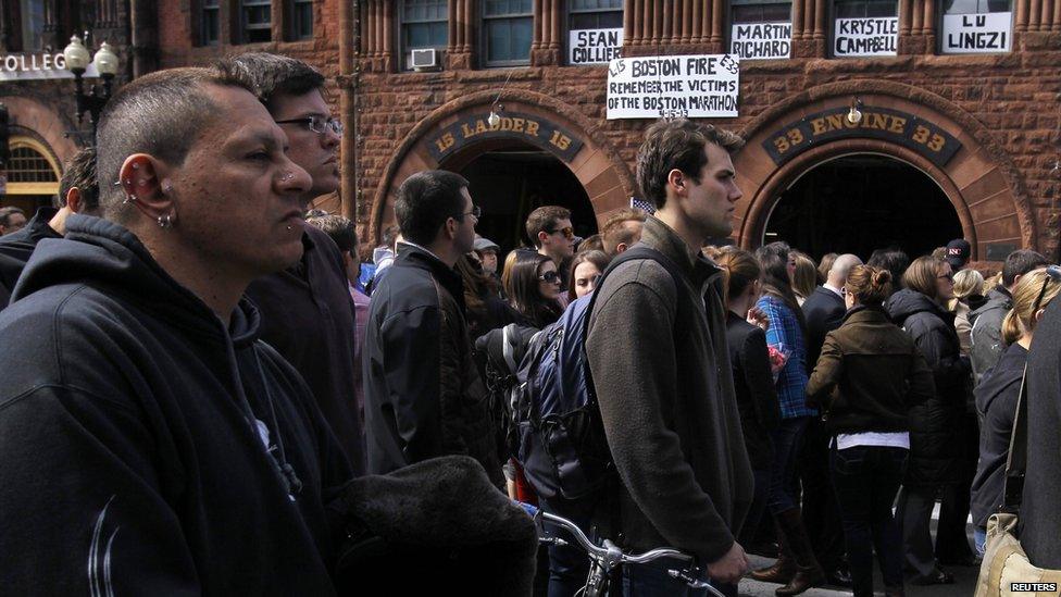 People observe a public silence on Boylston Street, Boston, 22 April