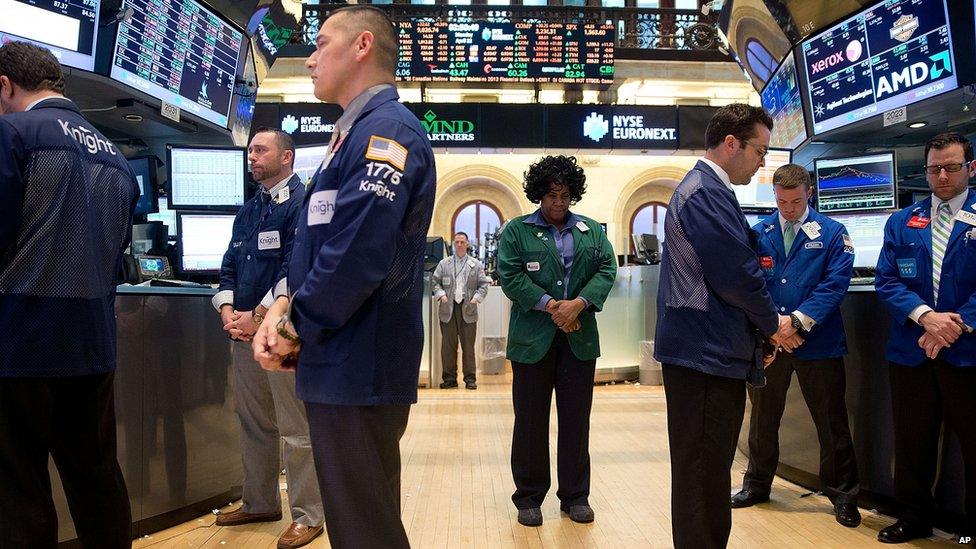 Traders at the New York Stock Exchange observe a silence, 22 April