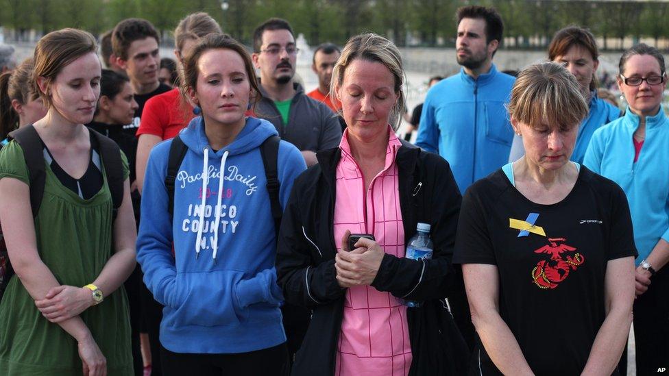 Runners observe a moment's silence in Paris, France, 22 April