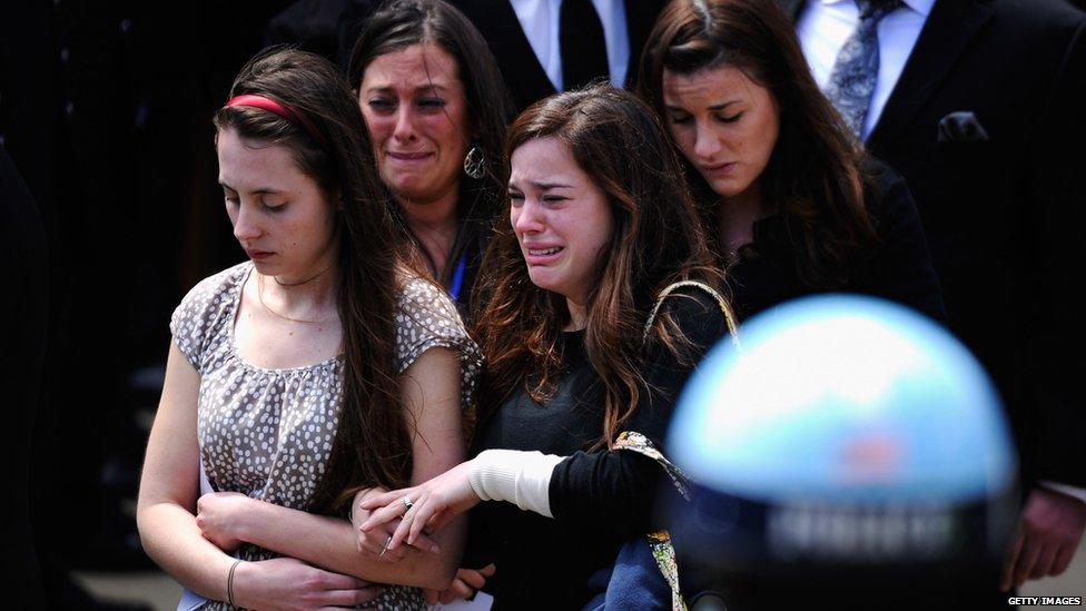 Mourners walk out of St Joseph's Catholic church after the funeral service for Krystle Campbell in Medford, Massachusetts, 22 April