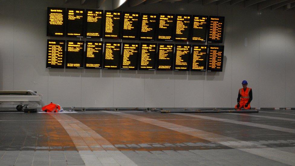 Information boards in the new concourse at New Street station