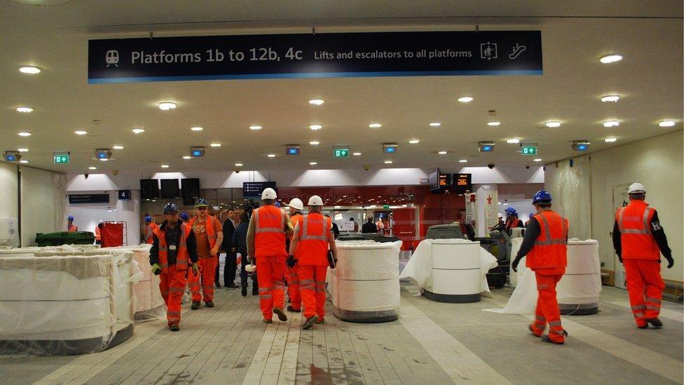 Builders at work in the new concourse at New Street station