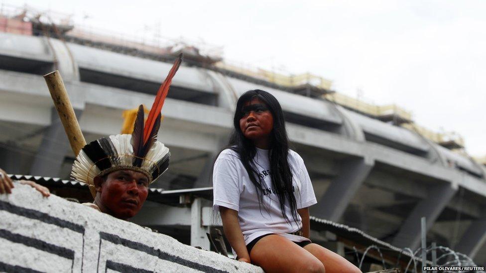 A Brazilian indigenous community protest inside the former Indian Museum, with the Maracana stadium seen in the background, in Rio de Janeiro, January 12, 2013.