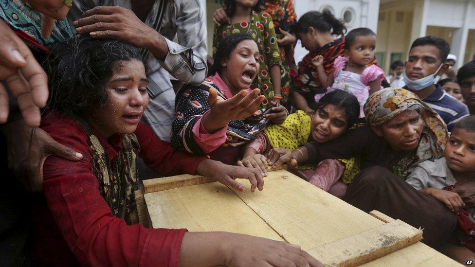 Relatives grieve over coffin of victim in Dhaka building collapse. 27 April 2013