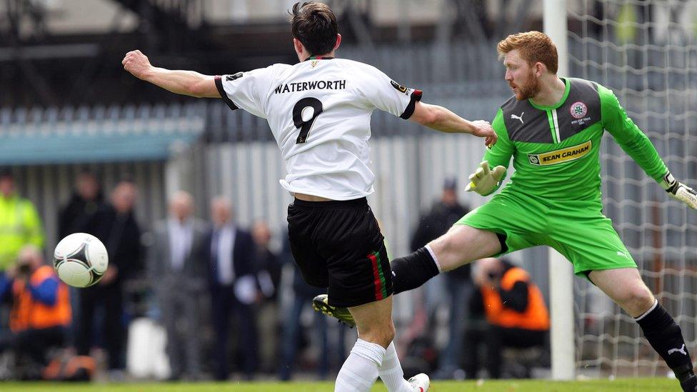 Glentoran striker Andy Waterworth wastes an excellent chance as keeper Conor Devlin keeps out his close-range shot