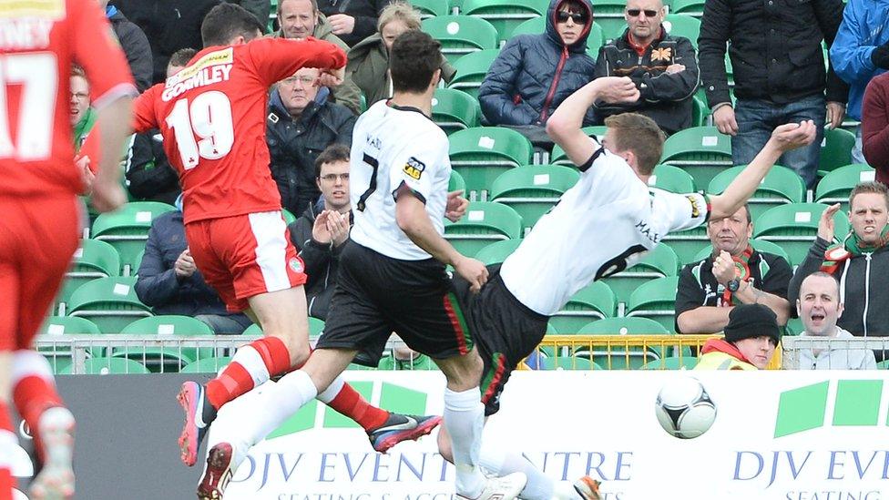 Cliftonville forward Joe Gormley slots in the opener in Windsor final